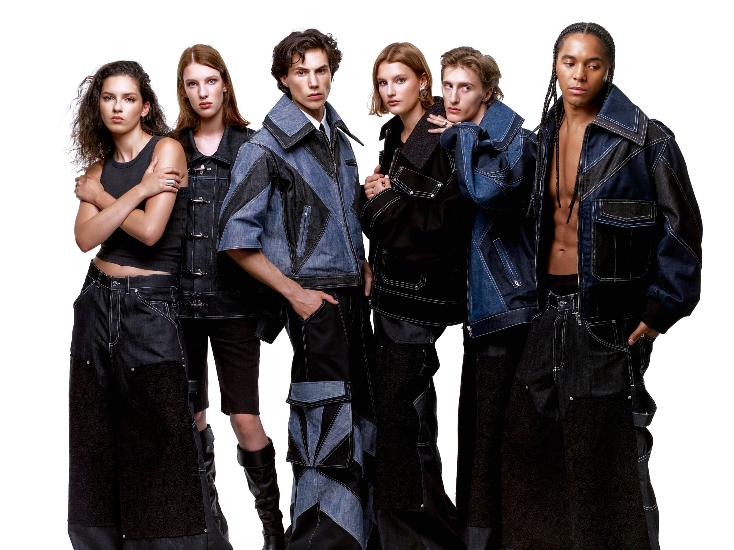 Collection I — V-VISION '26 campaign group portrait: six models wearing the collection's architectural denim.